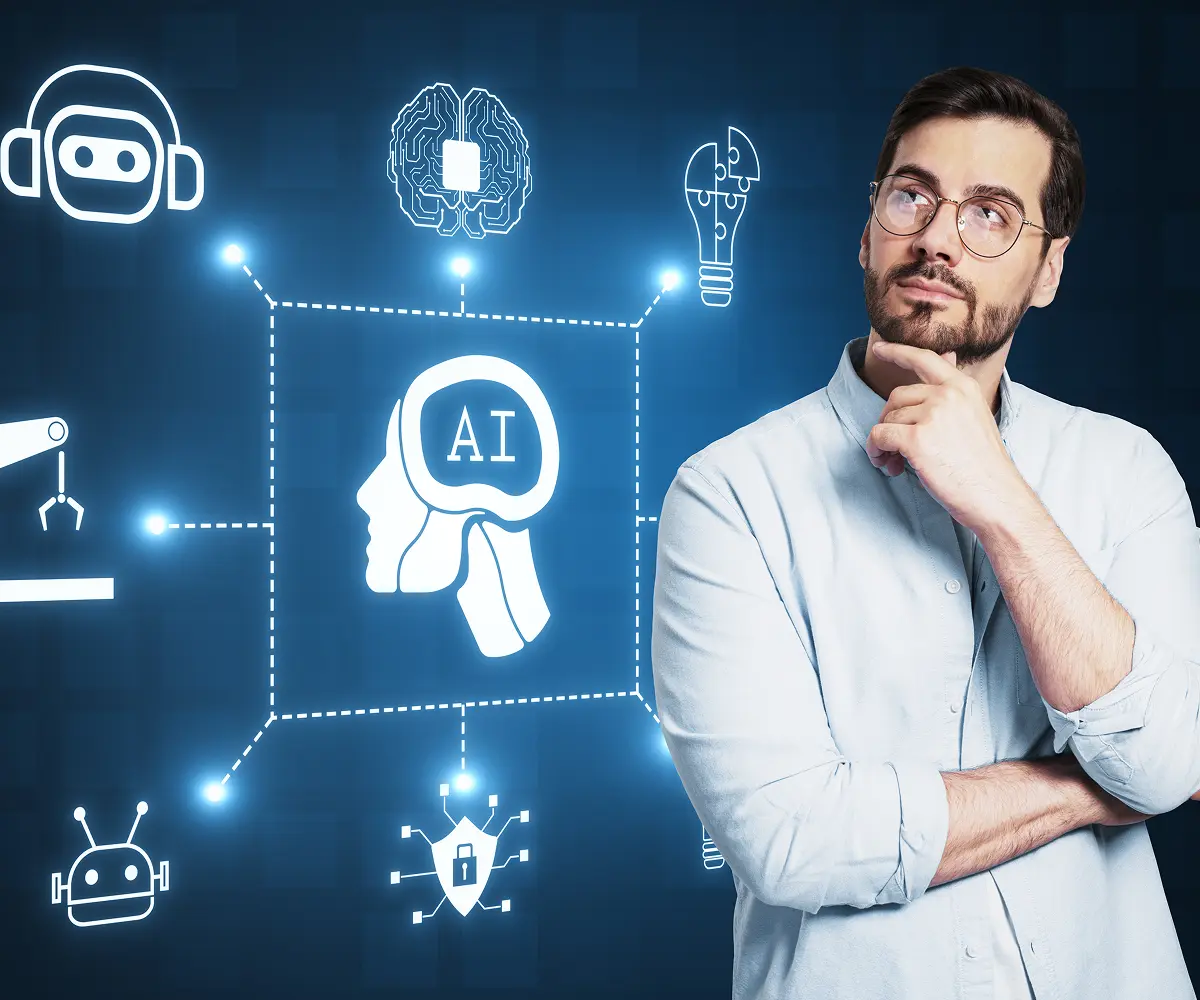 attractive-thoughtful-businessman-with-creative-glowing-ai-hologram-with-digital-human-head-blue-background-automated-machine-learning-artificial-intelligence-conversation-assistant-concept